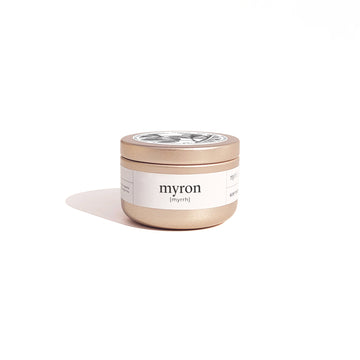 Travel size candle in brushed gold container