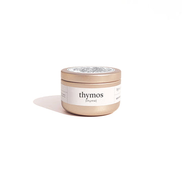 Travel size candle in brushed gold container